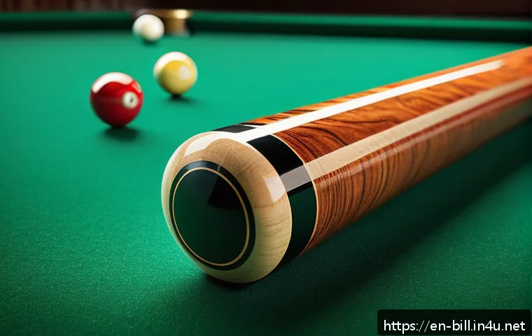 당구 큐 종류와 선택법 - A close-up, highly detailed image of a classic wooden pool cue made from polished maple wood, showca...